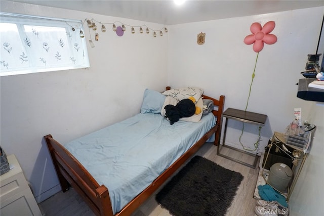 bedroom with light wood-type flooring