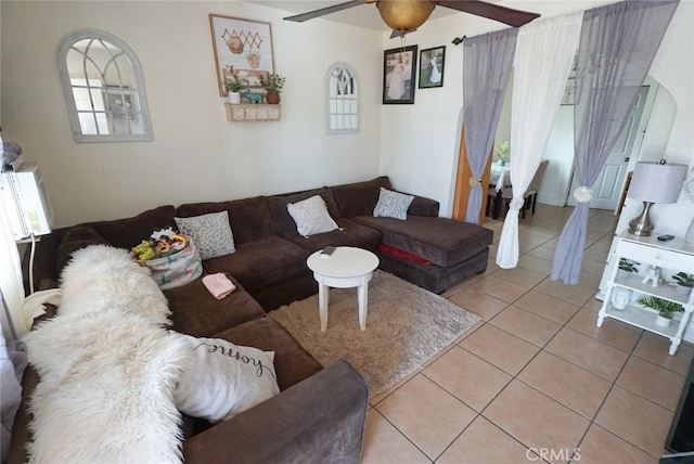 living room featuring a healthy amount of sunlight, ceiling fan, and tile patterned flooring