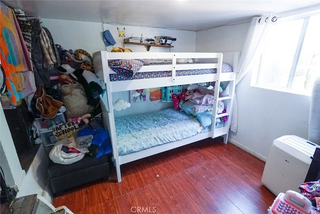 bedroom featuring dark wood-type flooring