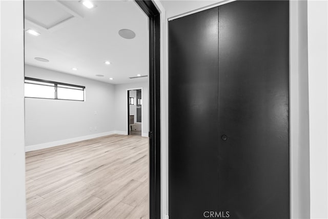 corridor with light wood-type flooring