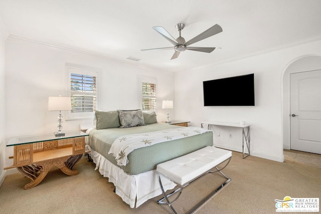 bedroom featuring crown molding, light colored carpet, and ceiling fan