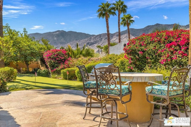 view of patio / terrace with a mountain view