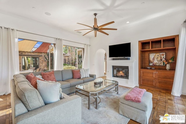 living room featuring parquet floors and ceiling fan