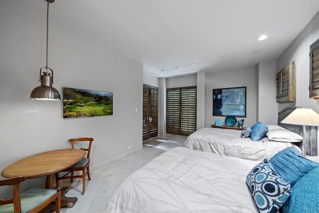 bedroom with light tile patterned floors