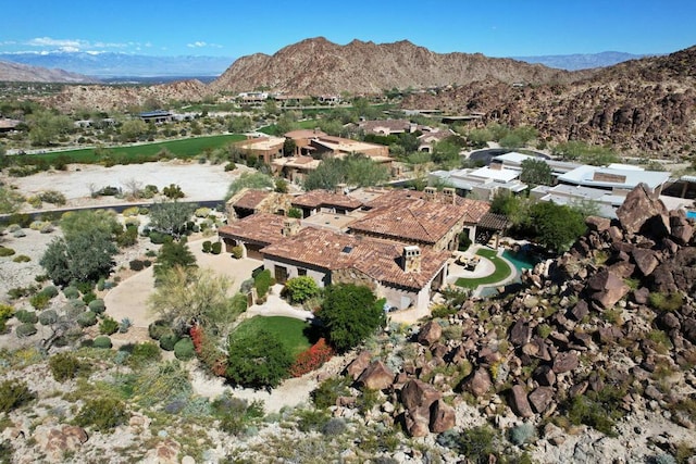 birds eye view of property with a mountain view