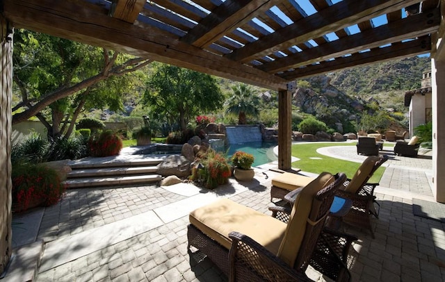 view of patio featuring a pool with hot tub and a pergola