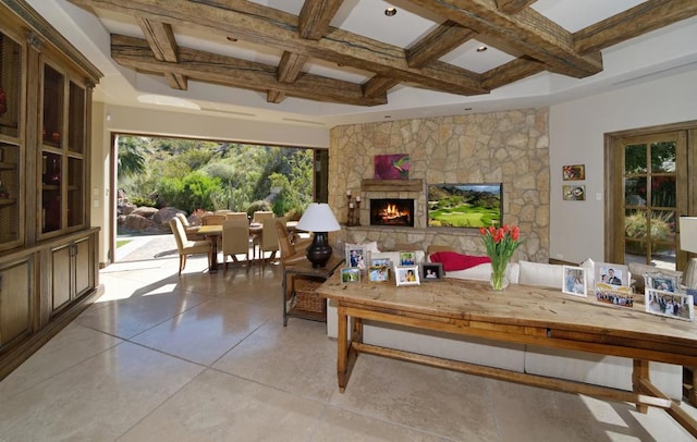 living room with beamed ceiling, coffered ceiling, and a fireplace