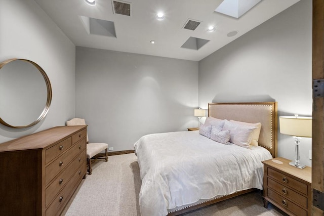 carpeted bedroom featuring a skylight