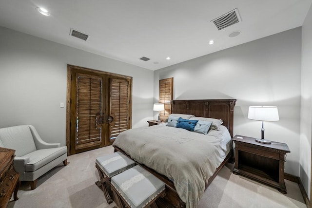 bedroom with light colored carpet