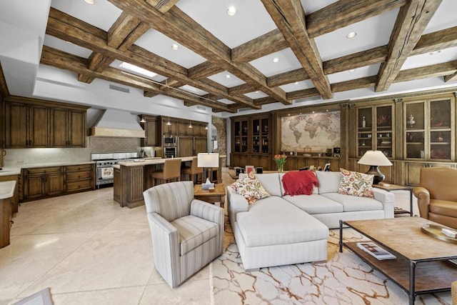 tiled living room featuring beam ceiling and coffered ceiling