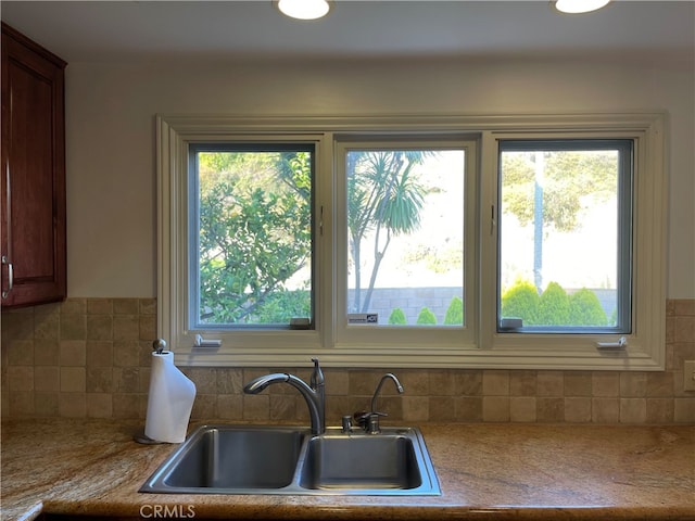 kitchen with decorative backsplash and sink