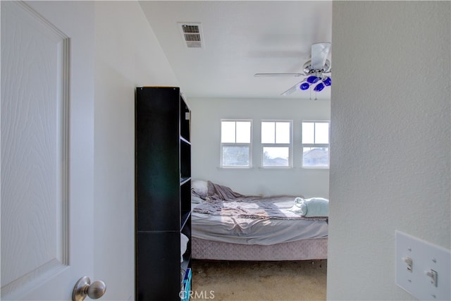 carpeted bedroom with ceiling fan