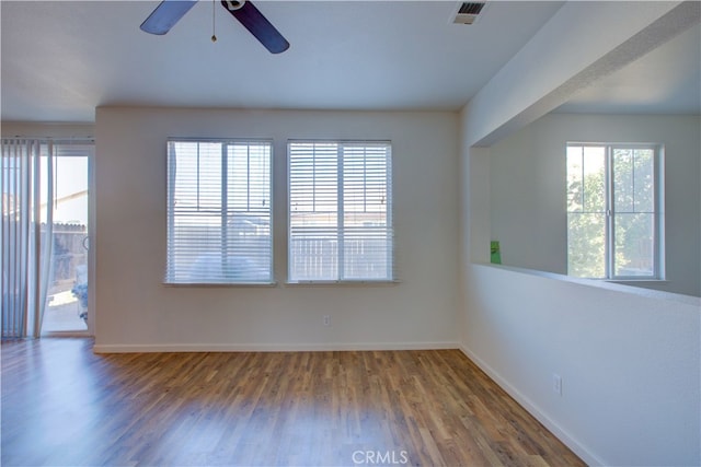 spare room featuring hardwood / wood-style flooring and ceiling fan