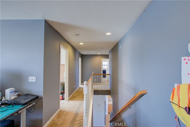 hallway featuring light carpet