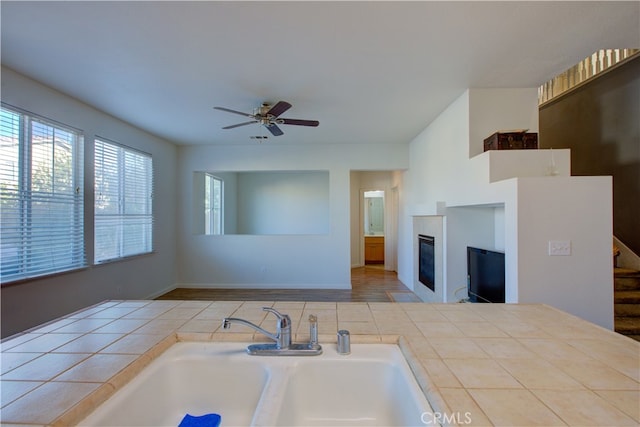 kitchen featuring sink and ceiling fan