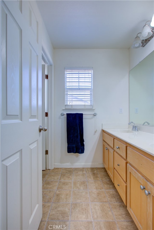 bathroom with vanity and tile patterned flooring