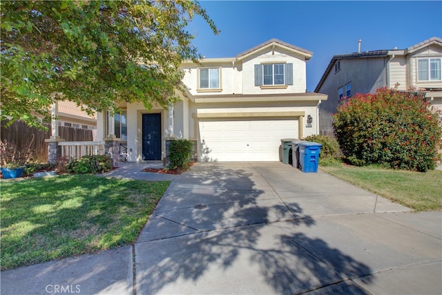 view of front of house with a front yard and a garage