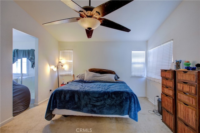 carpeted bedroom featuring ceiling fan, lofted ceiling, and multiple windows