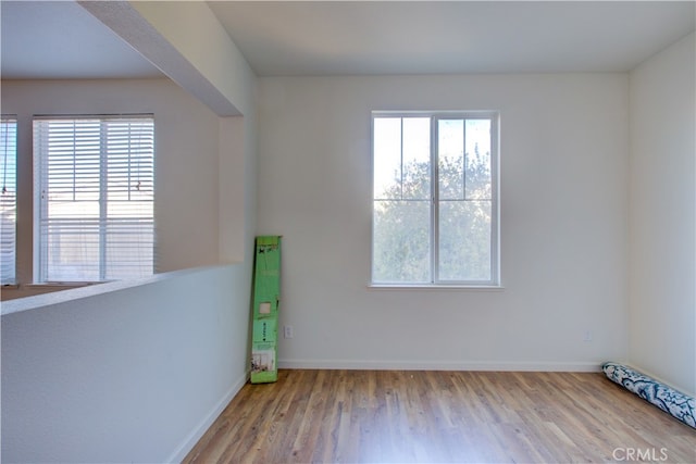 empty room featuring light hardwood / wood-style floors and a healthy amount of sunlight