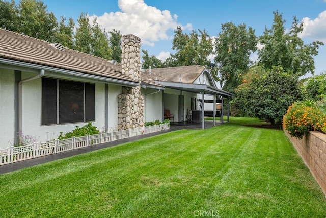 rear view of property with a lawn