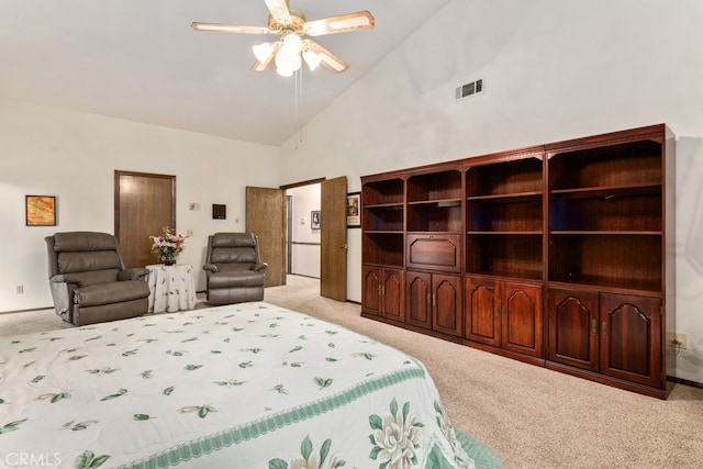 carpeted bedroom featuring high vaulted ceiling and ceiling fan