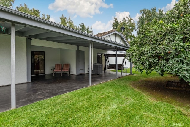 view of yard featuring a patio area and central AC unit