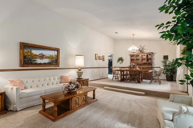 living room with a notable chandelier and light carpet