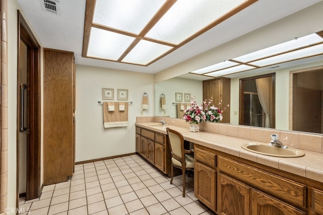 bathroom with vanity and tile patterned flooring