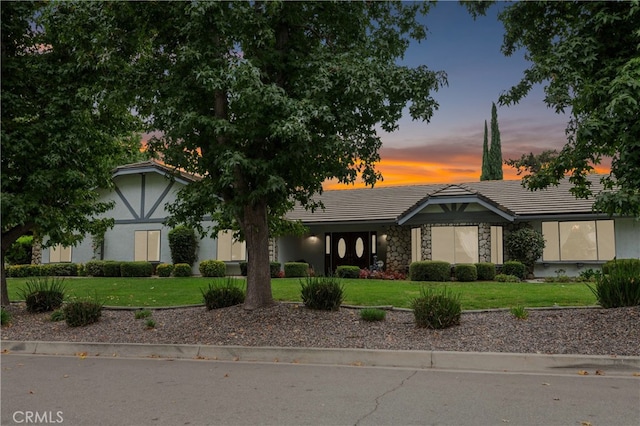 view of front of home with a yard