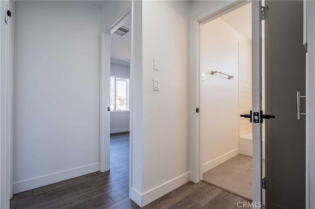 corridor featuring dark hardwood / wood-style floors