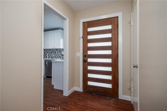 entryway with dark wood-type flooring