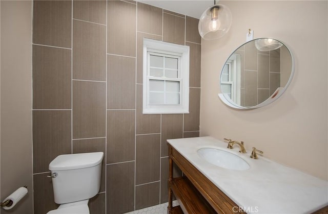 bathroom with toilet and vanity