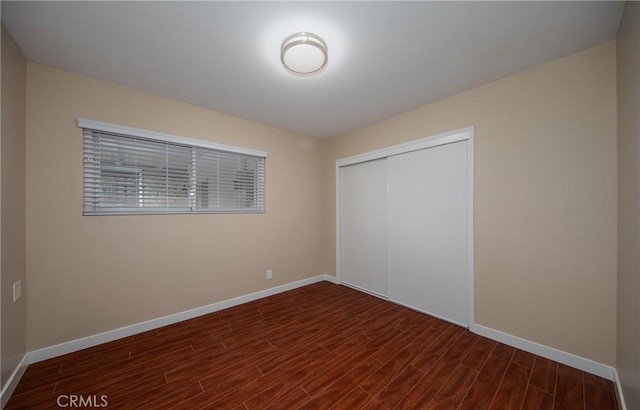 unfurnished bedroom with a closet