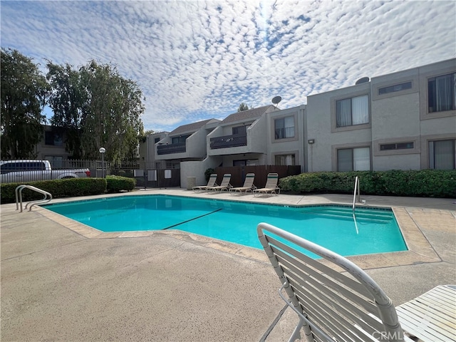 view of pool featuring a patio