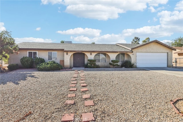 ranch-style house featuring a garage