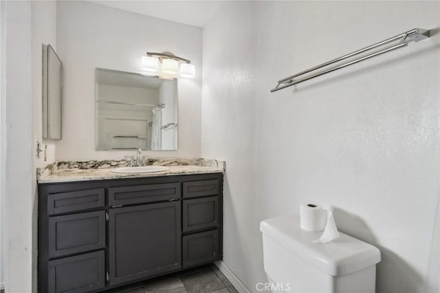 bathroom with vanity and toilet