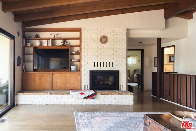 living room with vaulted ceiling with beams, wood ceiling, a fireplace, and dark hardwood / wood-style flooring