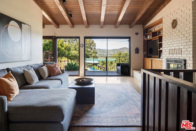 living room featuring wooden ceiling, hardwood / wood-style floors, and beamed ceiling