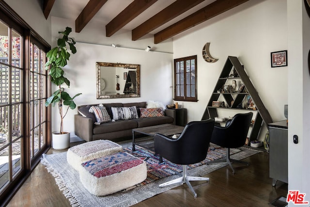 living room with beam ceiling and wood-type flooring