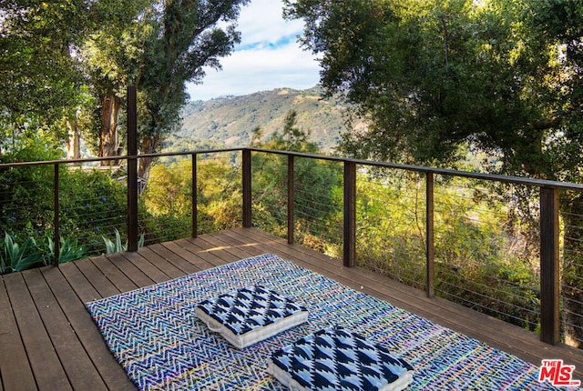 wooden terrace with a mountain view