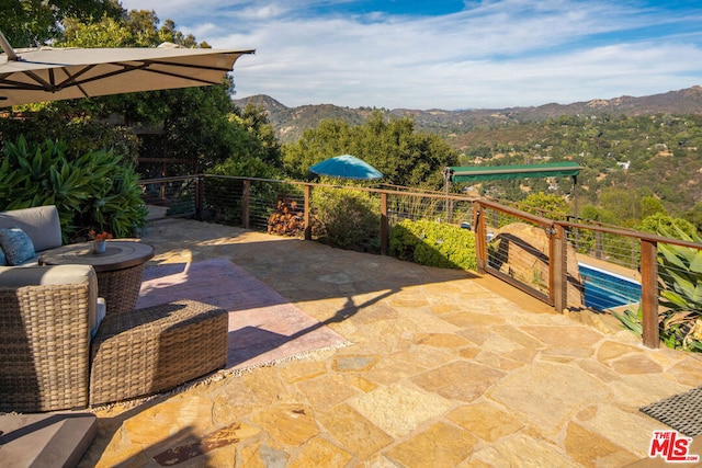 view of patio / terrace with a mountain view