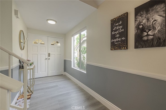 foyer entrance with light hardwood / wood-style floors