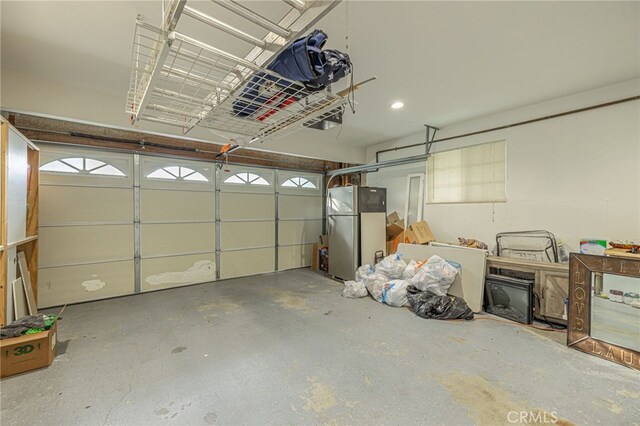 garage featuring stainless steel fridge