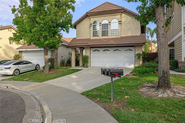 view of front facade with a front lawn and a garage