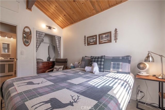 carpeted bedroom featuring lofted ceiling with beams, a closet, and wooden ceiling