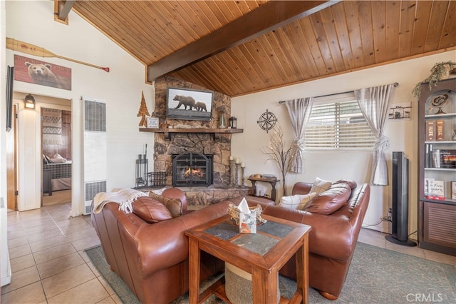 tiled living room with vaulted ceiling with beams, a stone fireplace, and wooden ceiling