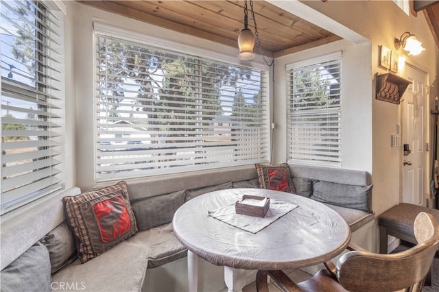 dining room with wood ceiling