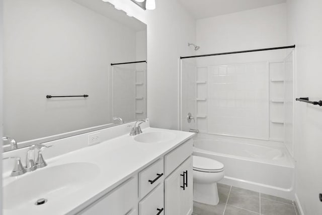 full bathroom with tile patterned floors, toilet,  shower combination, and vanity