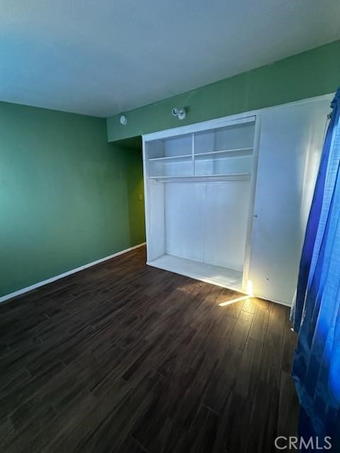 4772 Cebrian, New Cuyama, CA 93254 - unfurnished bedroom with dark wood-style floors and a closet