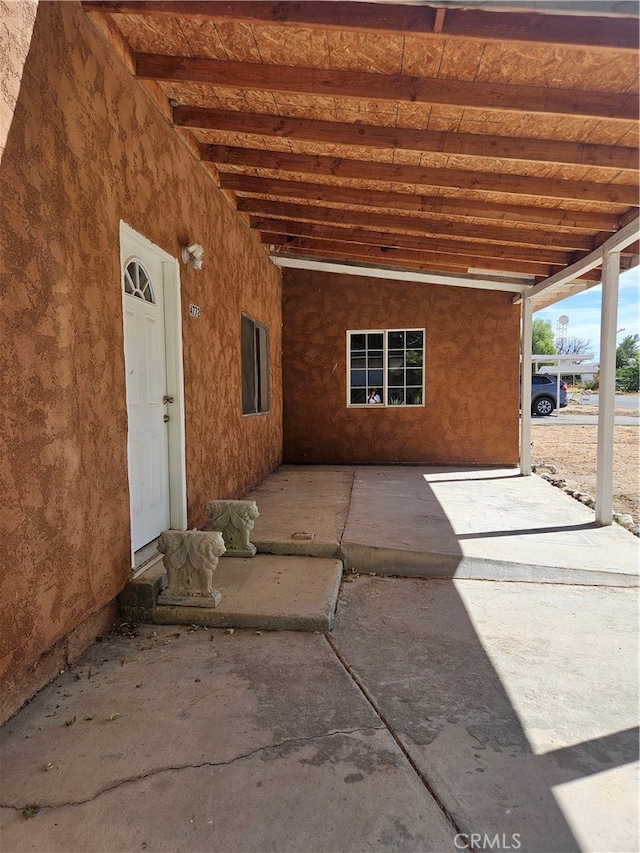 view of patio featuring a carport